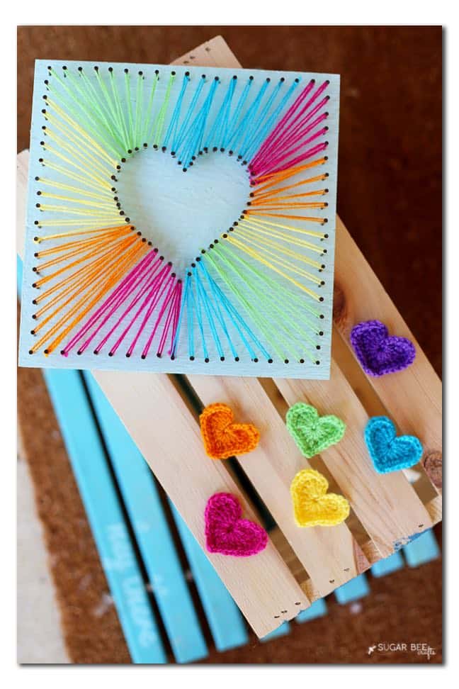 https://dadlifelessons.com/wp-content/uploads/2019/03/rainbow-crocheted-hearts-and-string-art-tutorial-copy.jpg