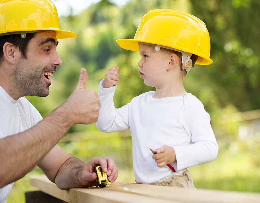 dad and son building together