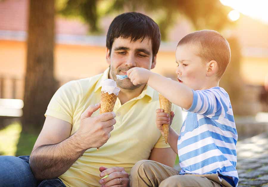 dad and son eating ice cream