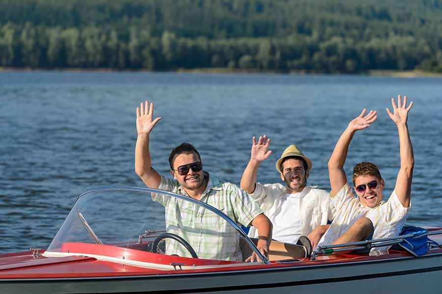 dad and sons in boat