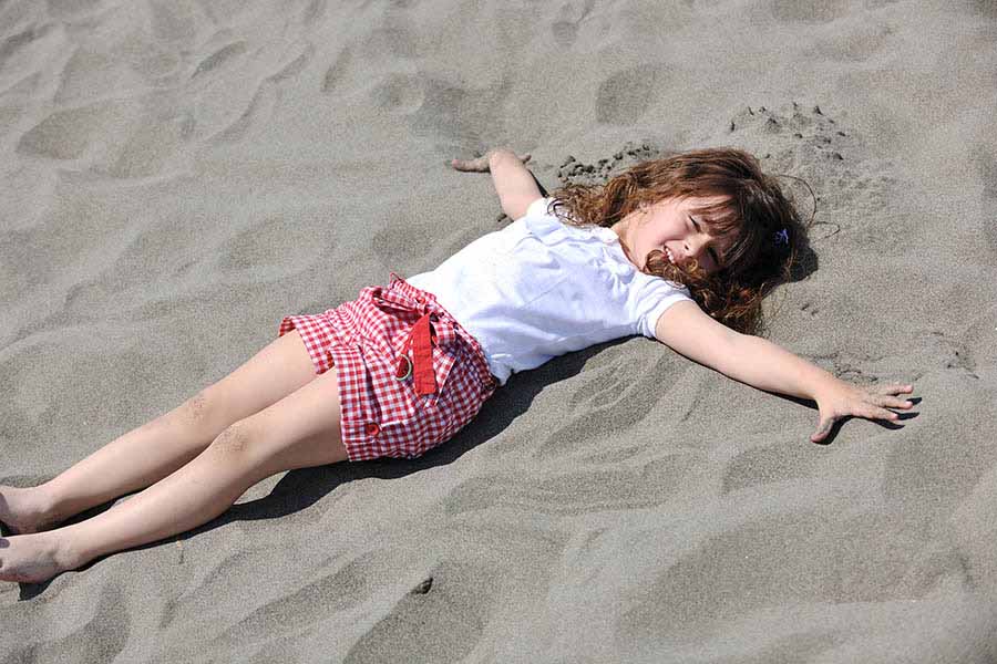 daughter playing in sand