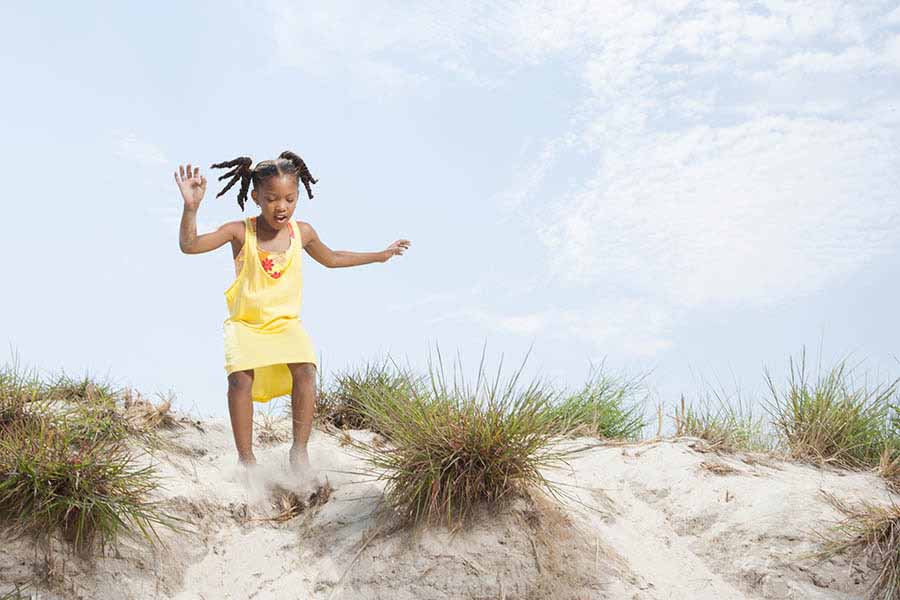 daughter playing on beach