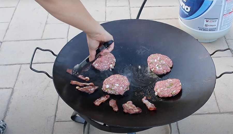 bacon burgers cooked on discada