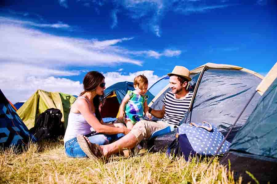 family with kids camping together