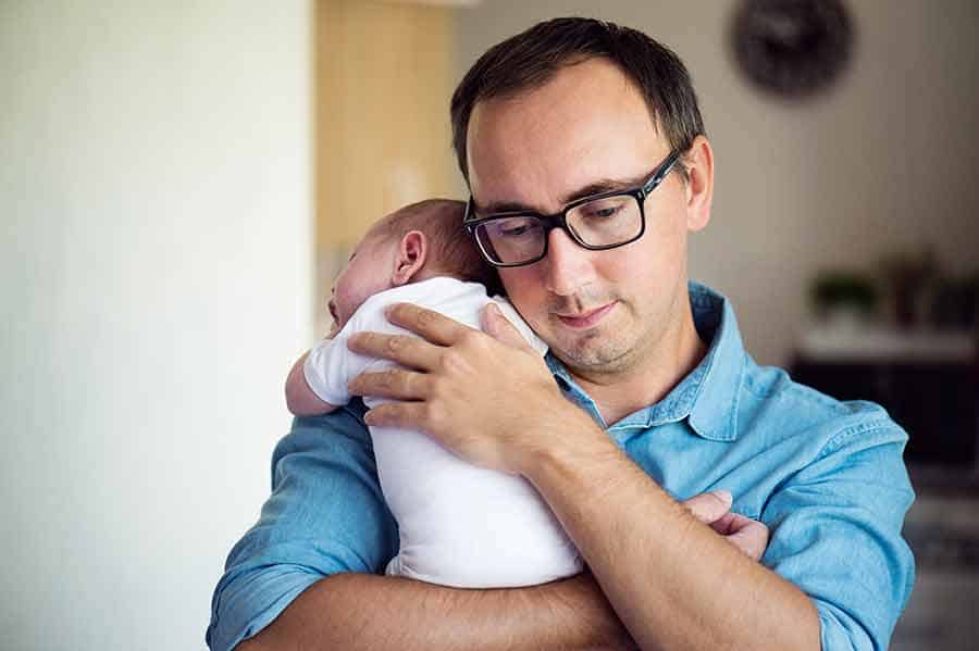 dad holding newborn