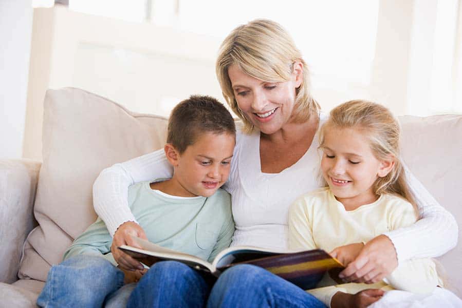 parent reading books to kids